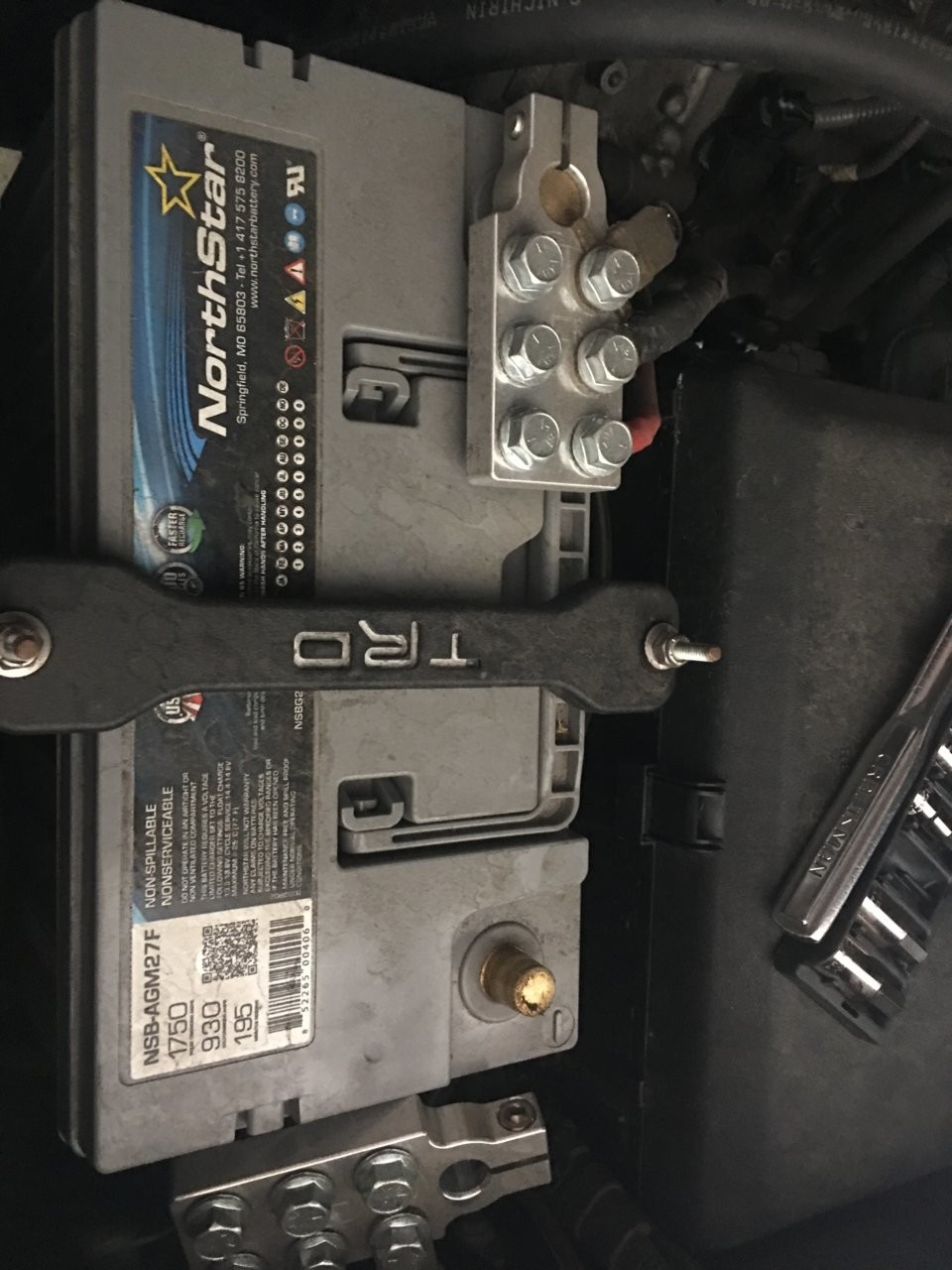 Disconnecting car battery terminal with 10mm socket for steering wheel removal safety