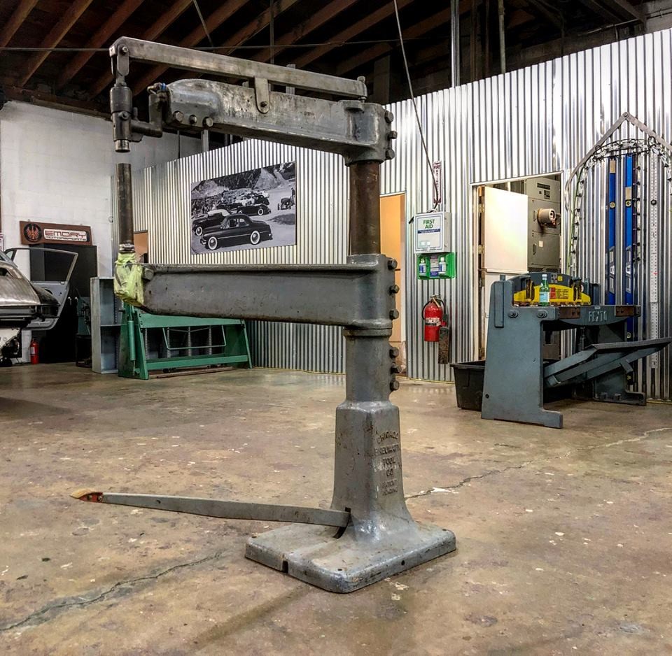 Rod Emory proudly displays the returned planishing hammer, a significant custom car shop tool from his family's history.