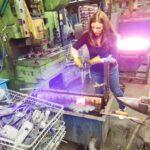 Shawna forging the DeWit Tool potting soil trowel.