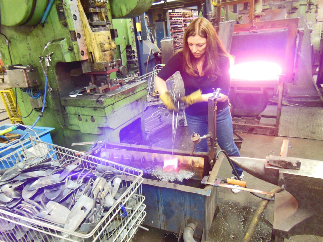 Shawna forging the DeWit Tool potting soil trowel.