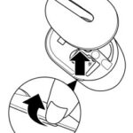 Opening the battery compartment of a Dell wireless mouse