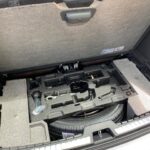 Original XC90 spare tire area with tools in foam insert