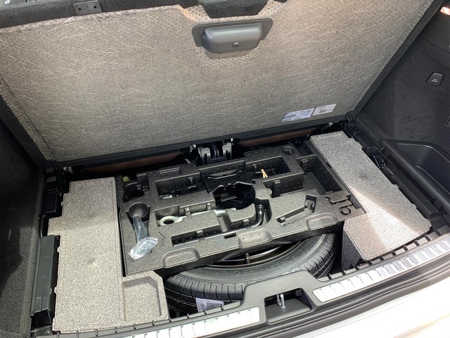 Original XC90 spare tire area with tools in foam insert